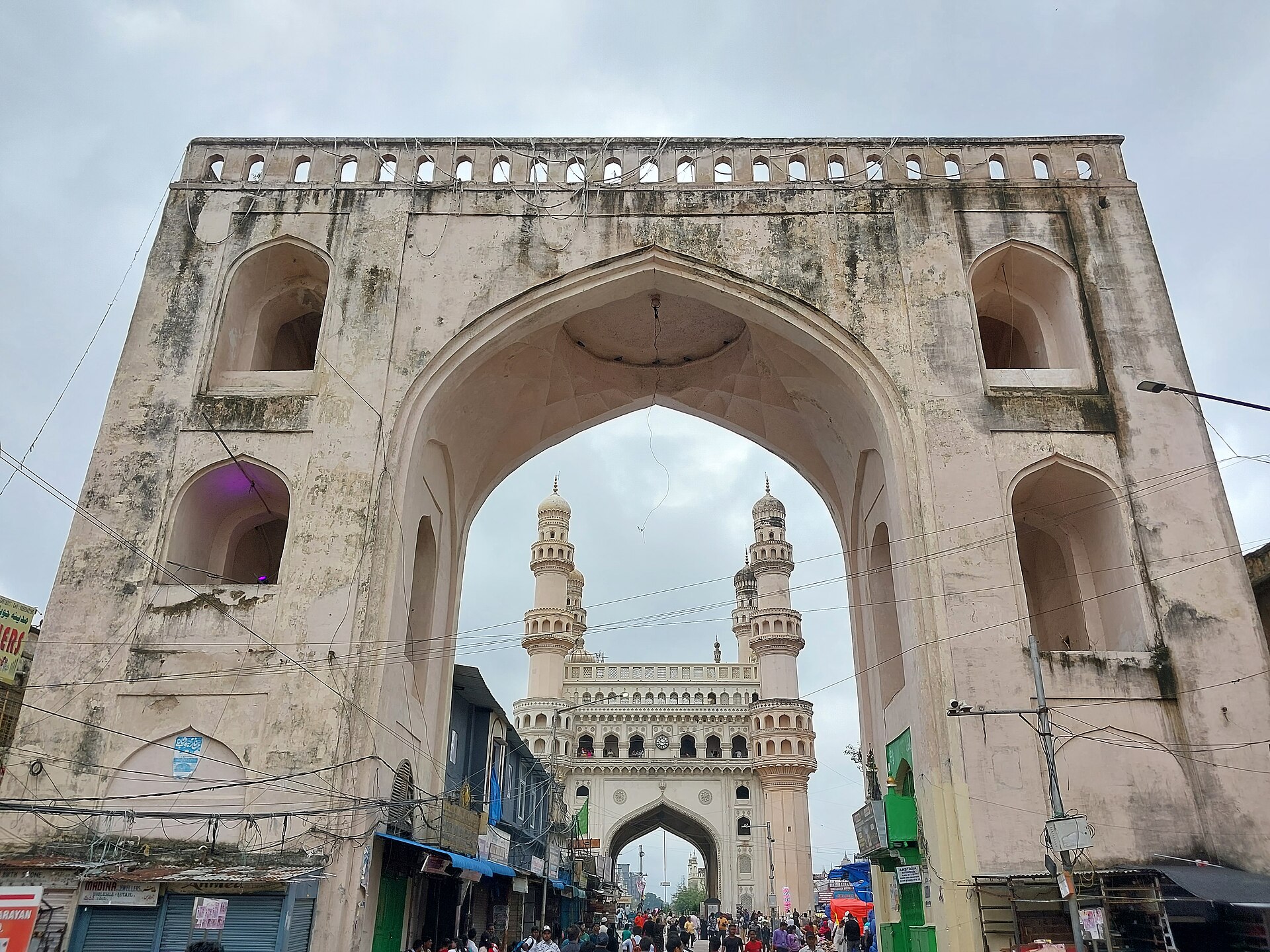 A pointed Char Kaman arch framing Charminar in Hyderabad