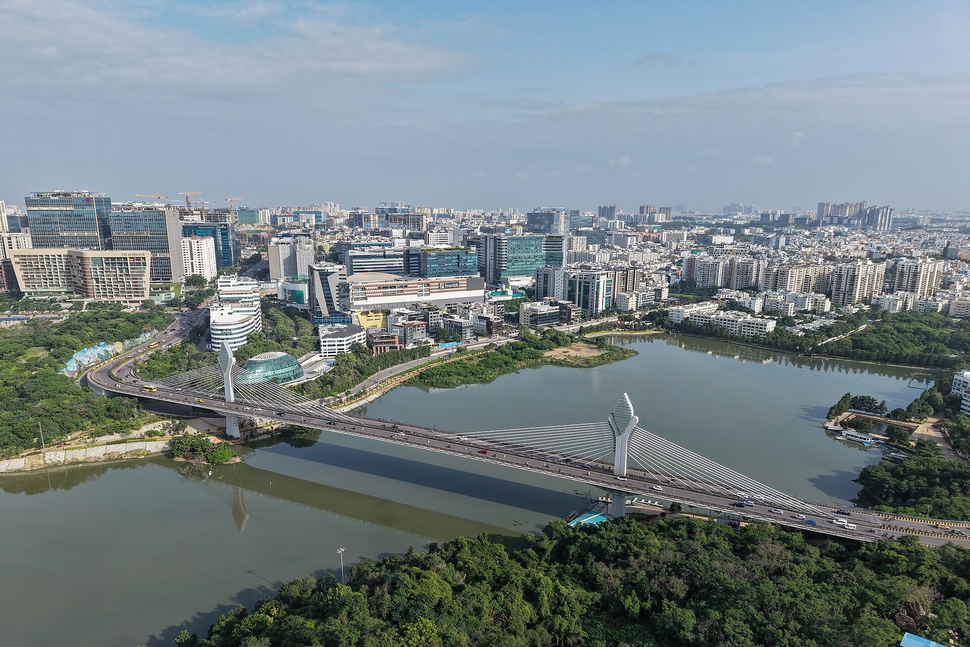 Aerial view of Durgam Cheruvu, its cable bridge and Hyderabad's Hitec City